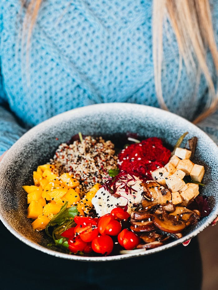 Colorful vegan Buddha bowl with fresh vegetables, tofu, and quinoa, perfect for a healthy meal.